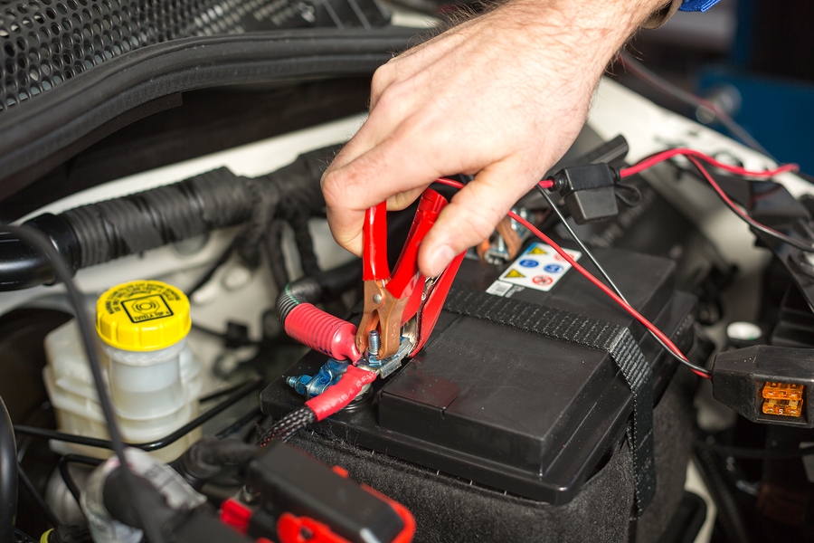 Car Mechanic Changing The Battery